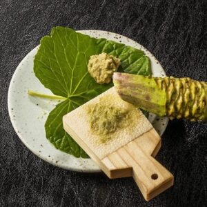 Mazuma wasabi plant rhizome grated and prepared for sushi.