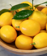 Yellow Meyer Lemon tree fruits in a bowl.