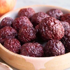 A bowl of dried Chinese jujube plant fruit.