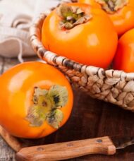Early Golden Persimmon in a basket.
