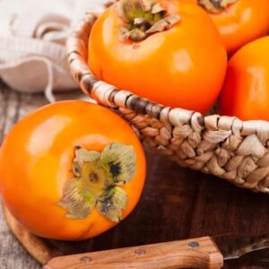Early Golden Persimmon in a basket.