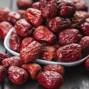 A mass of dried Empress gee red date plant fruits.