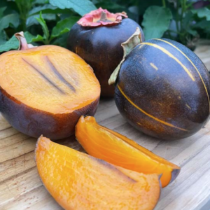 Kaki Persimmon with a dark skin and a yellowy orange flesh with dark stripes.