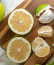 Melogold Grapefruit Tree fruit cut in half to reveal mellow gold flesh.