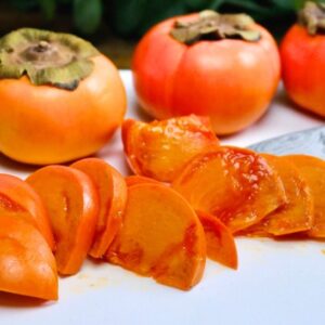 Sliced Prairie Gem Persimmon on a platter.