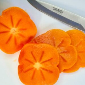 Slices of orange Prairie Star Persimmon fruit.