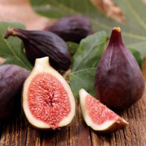 Violette de Bordeaux Fig Tree fruits. One cut open to reveal a succulent red centre.